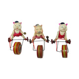 Three Vintage Celluloid Tin Wind-Up Pigs Riding on Tricycle