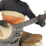 8" Tall Cloth Doll of a Banjo Playing Man Sitting on a Bale of Cotton