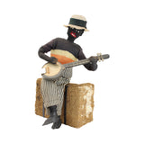 8" Tall Cloth Doll of a Banjo Playing Man Sitting on a Bale of Cotton