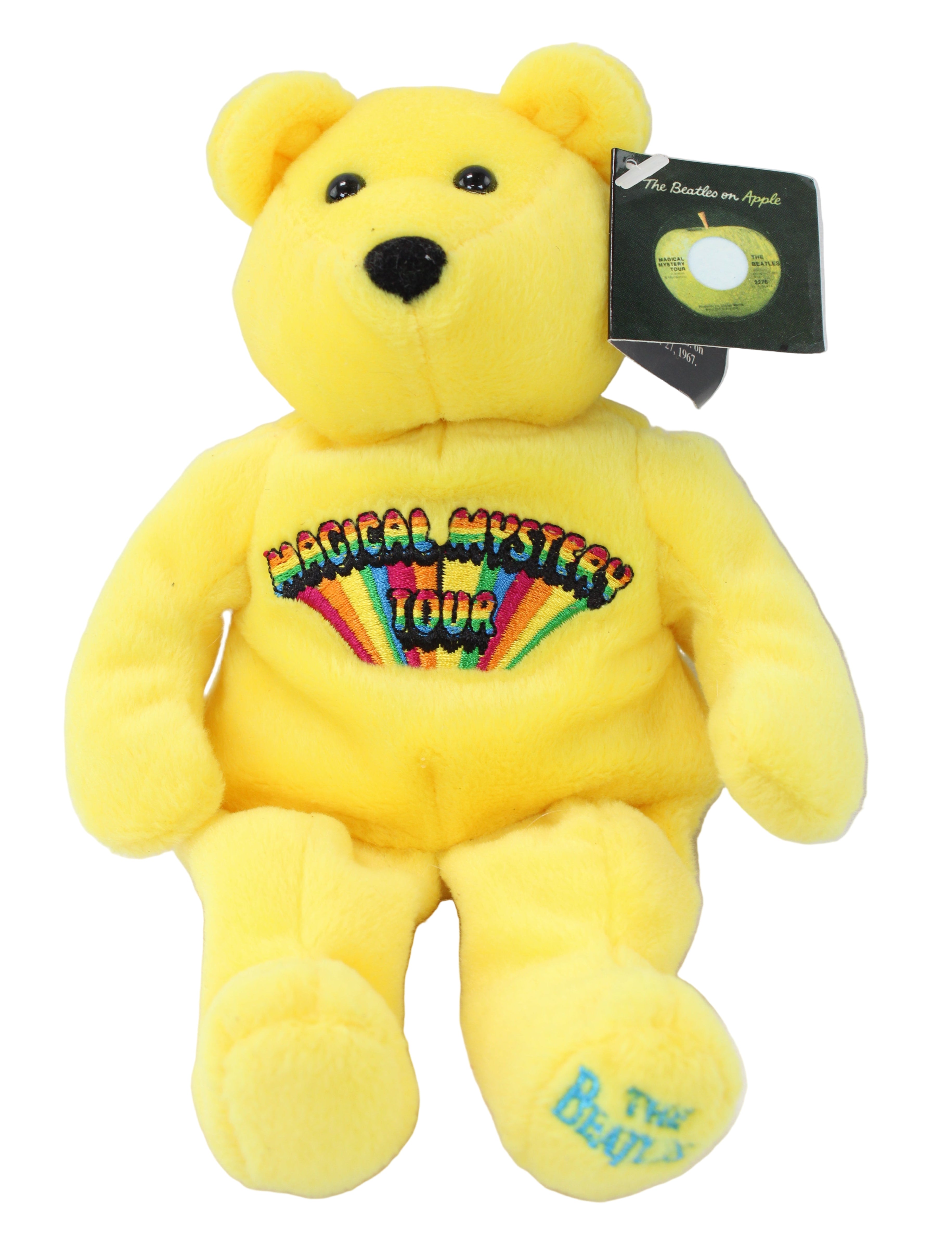 Yellow teddy bear with a colorful design on its chest against a white background