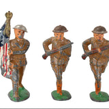 Three Barclay toy soldiers with American flags and rifles on a white background