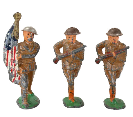 Three Barclay toy soldiers with American flags and rifles on a white background