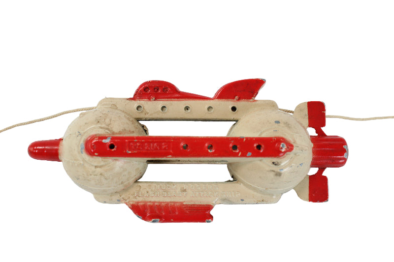 Toy rocket with red and beige design on a white background