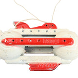 Vintage toy with red and white design on a white background