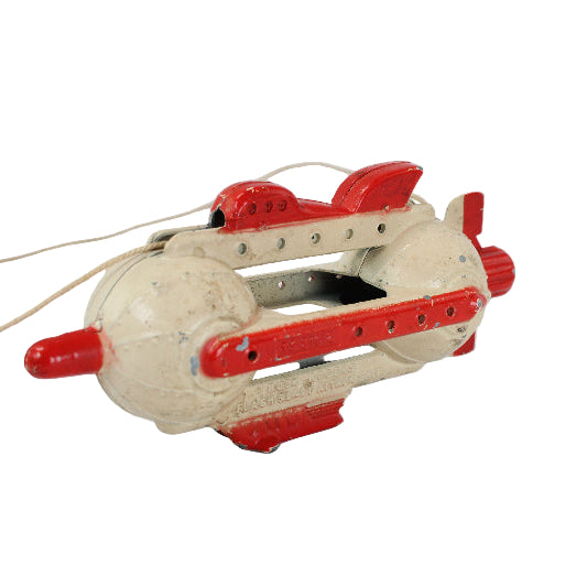 Toy submarine with red accents on a white background