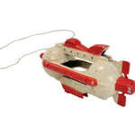 Toy boat with red accents on a white background