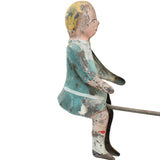 Vintage wooden toy figure of a boy with a white background