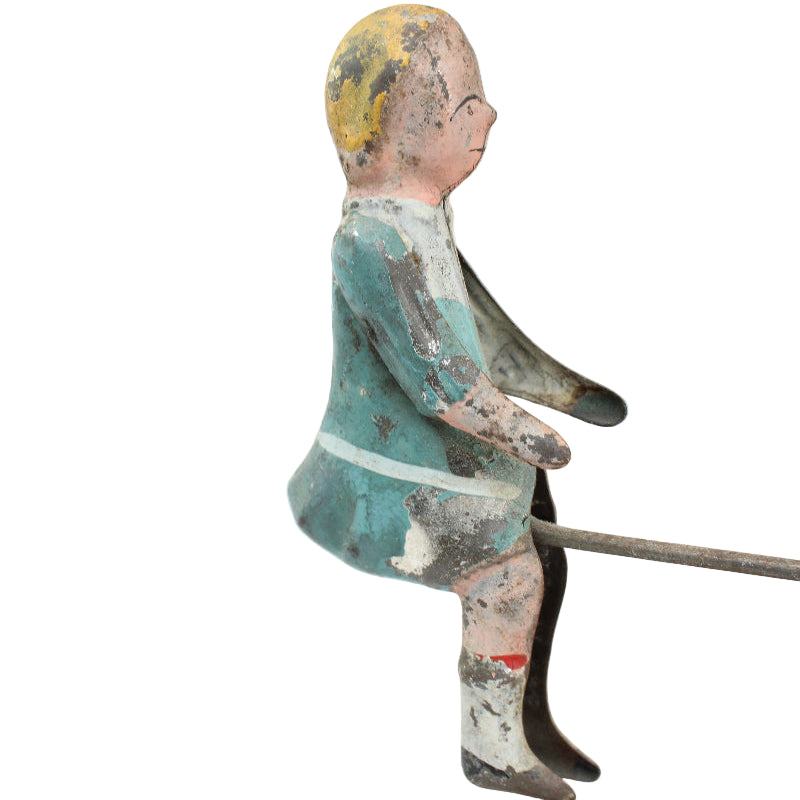 Vintage wooden toy figure of a boy with a white background