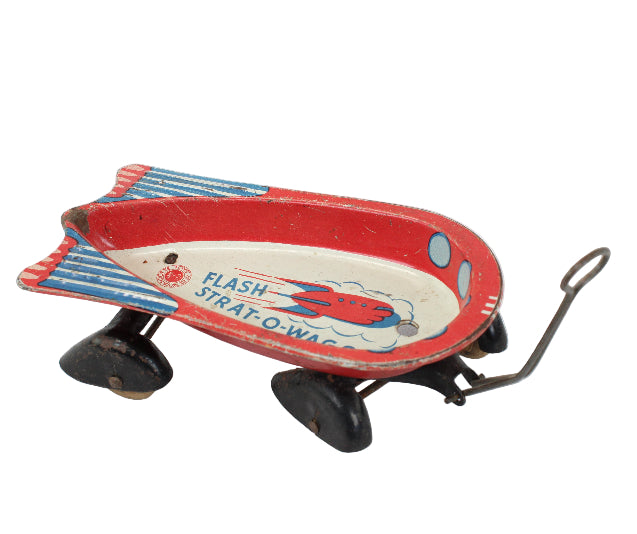 Vintage toy blimp with 'Flash Strat-O-Matic' branding on a white background