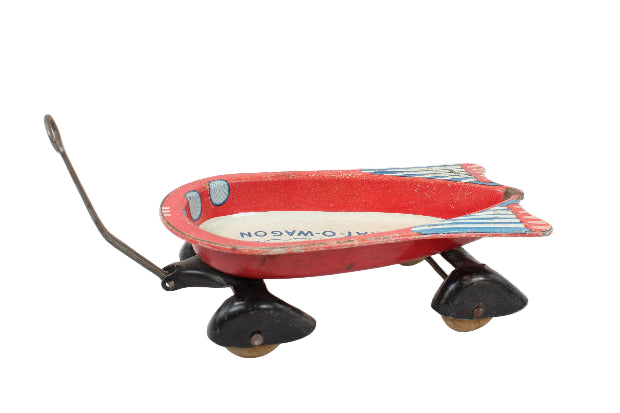 Red toy wagon with wheels on a white background