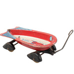Vintage toy boat with wheels on a white background