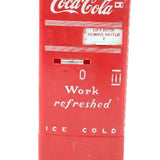 Red Coca-Cola cooler with text on a white background