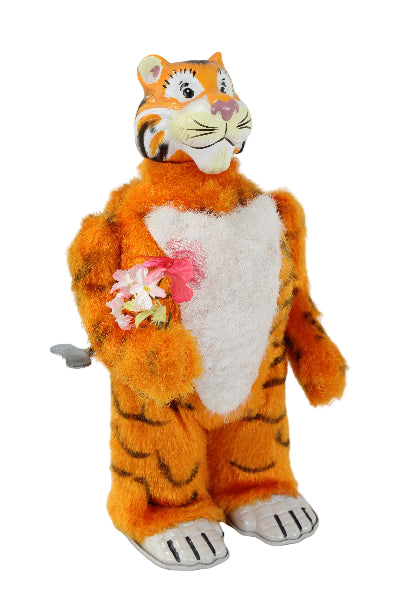 Plush tiger toy with a white chest on a light gray background