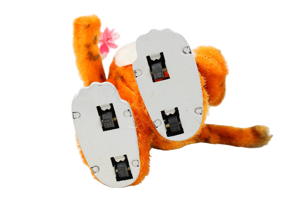 Plush tiger toy with electronic components on a white background