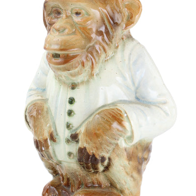 Carved stone tiger figurine on a white background