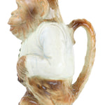 Decorative item resembling a shell with a white center on a white background