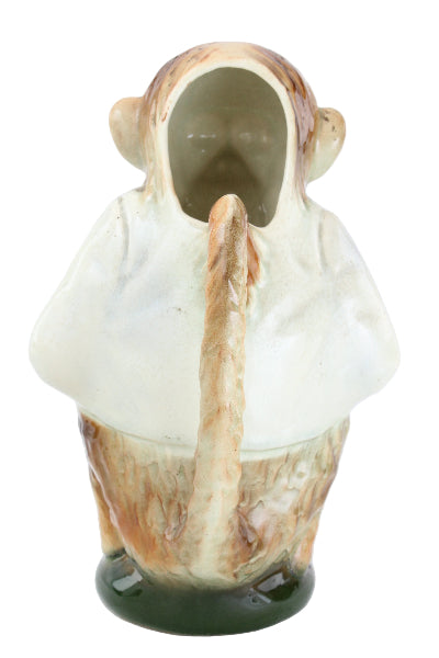 Decorative vase shaped like a person with a green interior on a white background