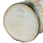 Close-up of a ceramic vase with a textured surface on a white background