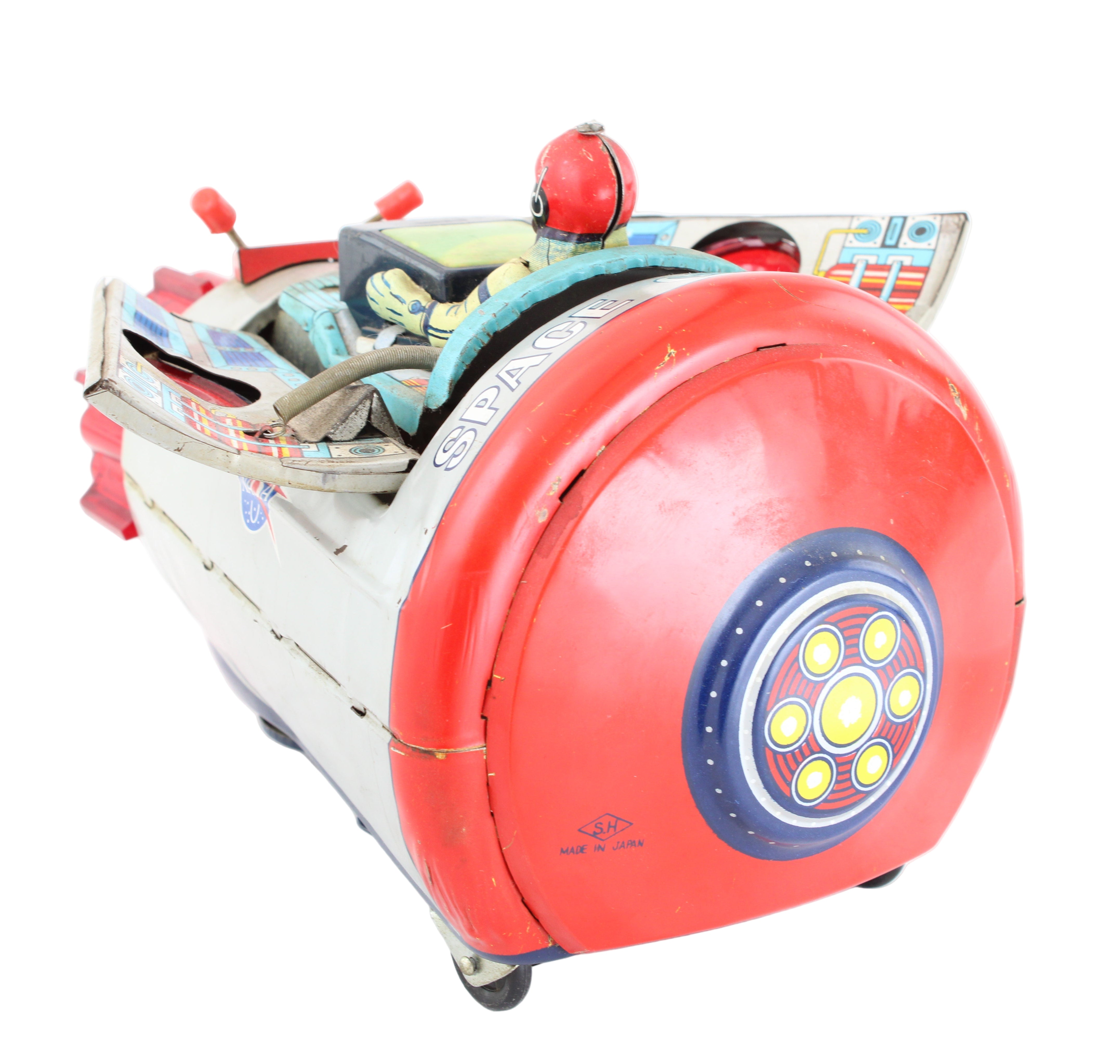 Toy robot with a red body and colorful details on a white background