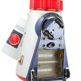 Vintage toy drill with red handle and buttons on a white background