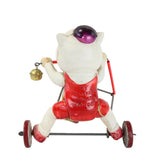 Vintage toy cat on a scooter with a bell on a white background