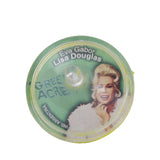 Round green container with a portrait of Eva Gabor and text on a white background