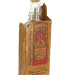 Vintage bottle with cardboard box on a white background