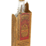 Vintage bottle with cardboard box on a white background