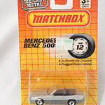 Matchbox Mercedes-Benz toy car on a yellow packaging with branding.