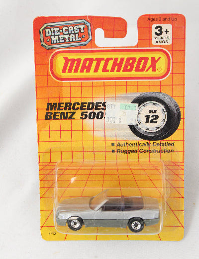 Matchbox Mercedes-Benz toy car on a yellow packaging with branding.
