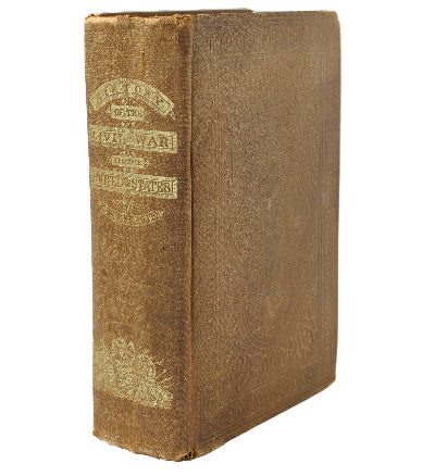 Vintage book with decorative spine on a white background