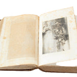 Open book with a black and white photograph inside on a white background