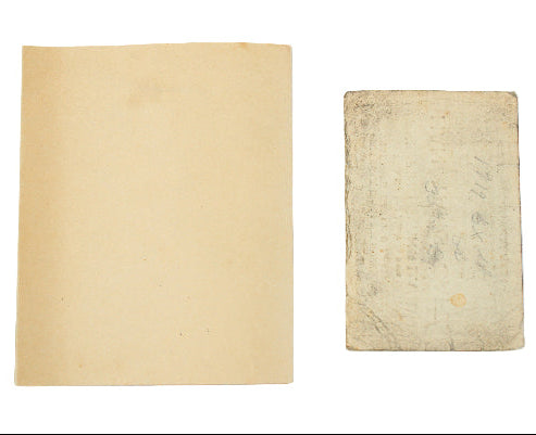 Two vintage books with yellowed pages on a white background