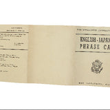 Folded paper with text and a logo on a white background