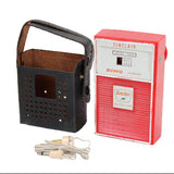 Vintage Sinclair Dino radio with packaging on a white background