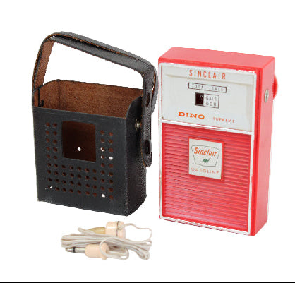 Vintage Sinclair Dino radio with packaging on a white background