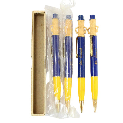 Set of three blue and yellow pens in a clear plastic packaging with a gold box on a white background.