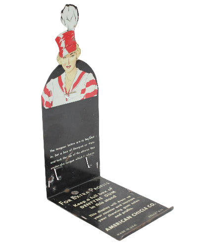 Vintage American Chicle Company product with a woman's face and text on a white background