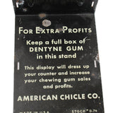 Dentyne Gum display stand with promotional text on a white background
