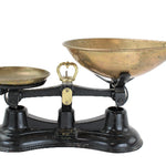 Vintage scale with brass bowls on a white background