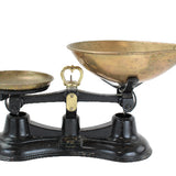 Vintage scale with brass bowls on a white background