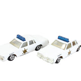 Two toy police cars on a white background