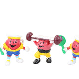Four colorful character figurines performing different activities on a white background