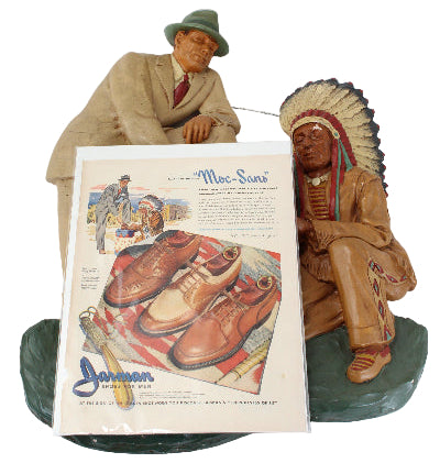 Decorative Native American figurines with a vintage-style shoe advertisement on a white background