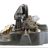 Vintage typewriter ribbon mechanism on a white background
