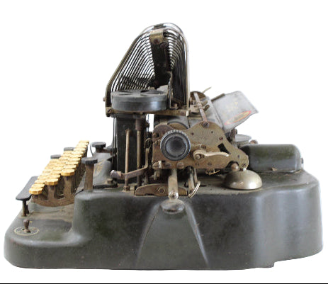 Vintage typewriter ribbon mechanism on a white background