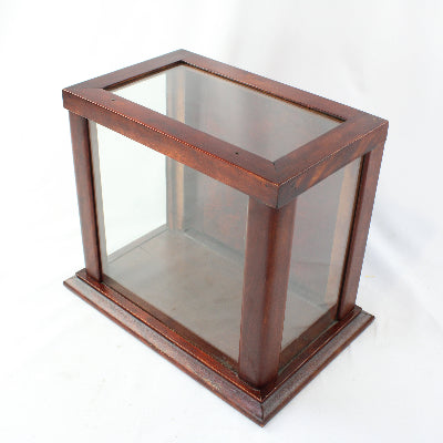 Wooden display case with glass front on a white background
