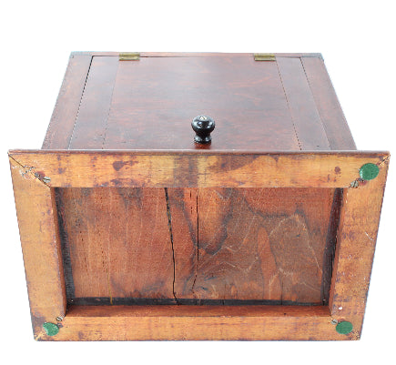 Wooden box with a lid on a white background