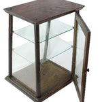 Hexagonal glass display case with wooden frame on a white background