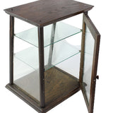 Hexagonal glass display case with wooden frame on a white background